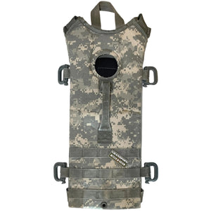 Good Condition U.S. Military Improved ACU UCP Digital Camo Hydration Pack With Grimlocs with a Grandpops Army Navy logo.