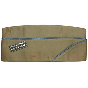 WW2 U.S. Army Khaki Service Dress Uniform Garrison Cap W/ Sky-Blue Infantry Piping with a Grandpops Army Navy logo.