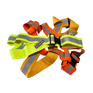 Three reflective safety belts in yellow, orange, and gray on a white background