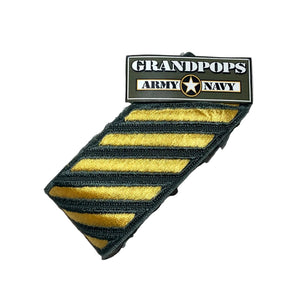 A Roll of U.S. Army Cold War-Era Green Shade 159 Overseas Service Stripe Class A Uniform Patches with a Grandpops Army Navy logo.
