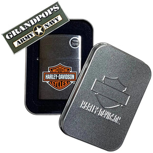 Harley-Davidson Zippo lighter in a metal case with a 'Grandpops Army Navy' logo.